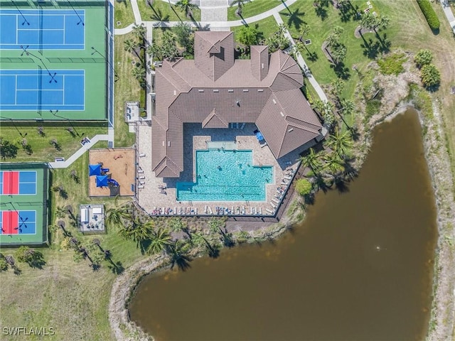 birds eye view of property with a water view