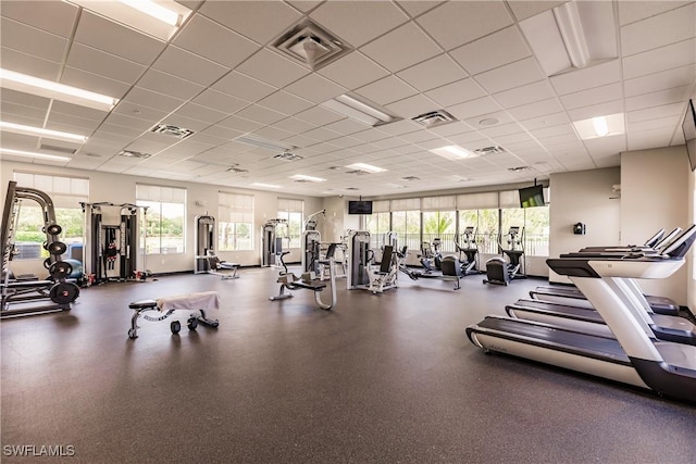 workout area featuring visible vents and a paneled ceiling