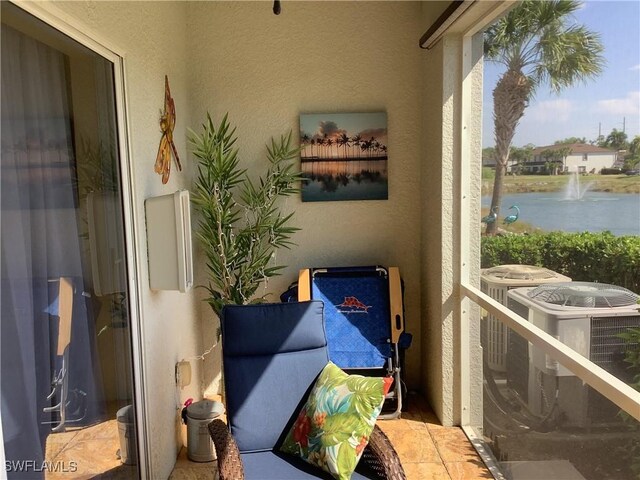 11739 Eros Rd, Lehigh Acres, FL 33971 - balcony featuring central AC unit and a water view