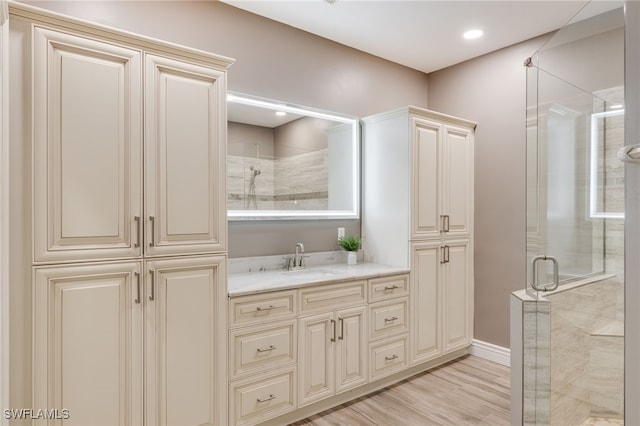 11991 Champions Green Way Unit 608, Fort Myers, FL 33913 - full bathroom featuring a stall shower, vanity, wood finished floors, and baseboards