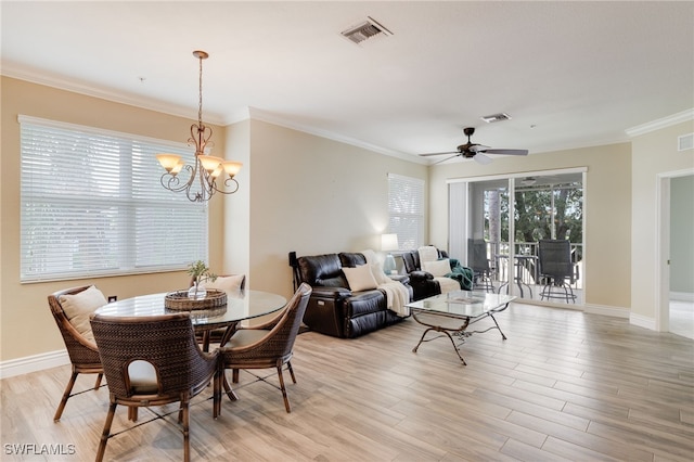 11991 Champions Green Way Unit 608, Fort Myers, FL 33913 - dining area with light wood-type flooring, a chandelier, ornamental molding, a ceiling fan, and baseboards