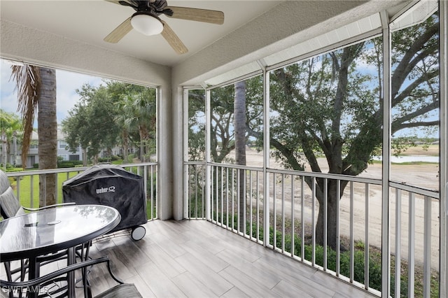 11991 Champions Green Way Unit 608, Fort Myers, FL 33913 - sunroom / solarium with ceiling fan and outdoor dining area