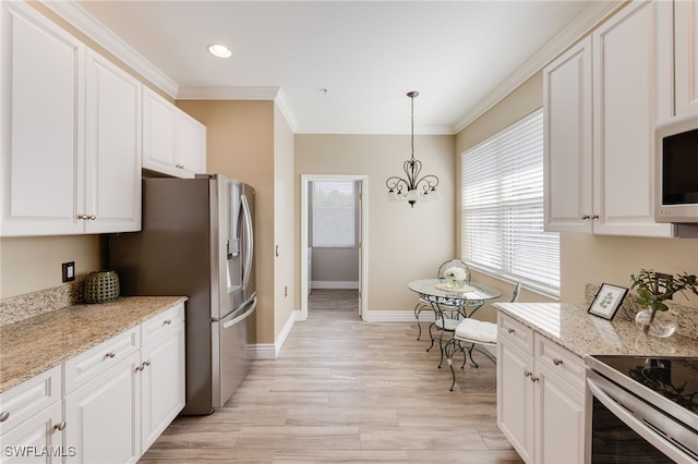11991 Champions Green Way Unit 608, Fort Myers, FL 33913 - kitchen with ornamental molding, white cabinetry, stainless steel appliances, baseboards, and light wood finished floors