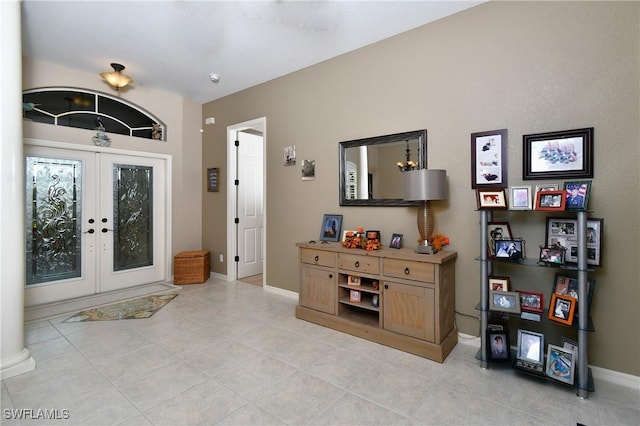 24342 Saragossa Ln, Punta Gorda, FL 33955 - entryway featuring baseboards, french doors, and light tile patterned floors