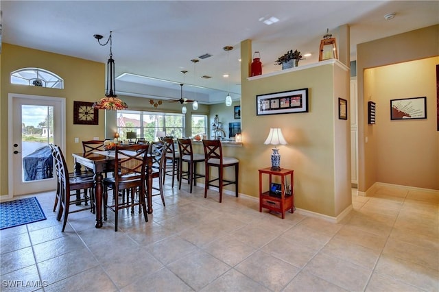 24342 Saragossa Ln, Punta Gorda, FL 33955 - dining area featuring baseboards, visible vents, ceiling fan, and light tile patterned floors