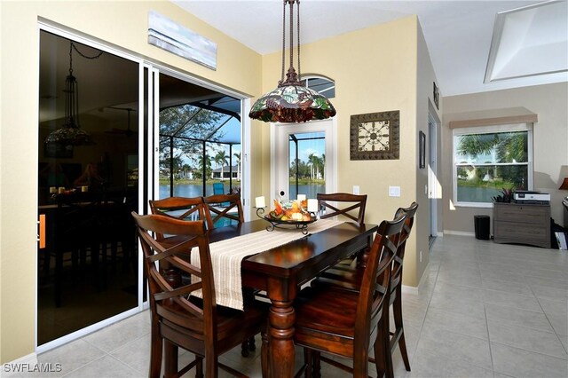 24342 Saragossa Ln, Punta Gorda, FL 33955 - dining room featuring light tile patterned flooring and baseboards