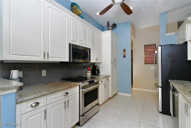 24342 Saragossa Ln, Punta Gorda, FL 33955 - kitchen with light tile patterned flooring, ceiling fan, tasteful backsplash, and appliances with stainless steel finishes