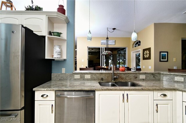 24342 Saragossa Ln, Punta Gorda, FL 33955 - kitchen with a sink, white cabinetry, appliances with stainless steel finishes, and open shelves