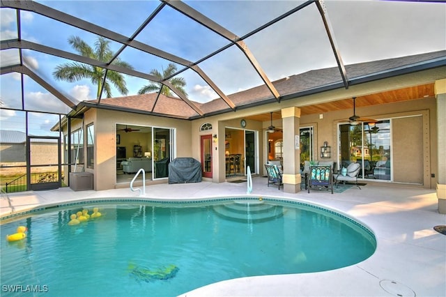 24342 Saragossa Ln, Punta Gorda, FL 33955 - outdoor pool featuring a lanai, ceiling fan, and a patio area