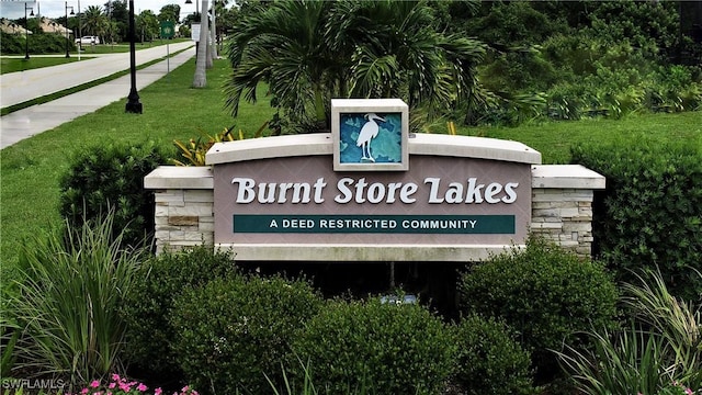 24342 Saragossa Ln, Punta Gorda, FL 33955 - community / neighborhood sign with a lawn