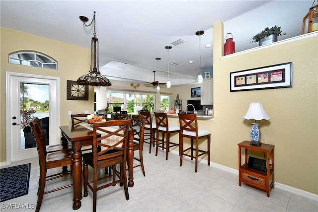 24342 Saragossa Ln, Punta Gorda, FL 33955 - dining space featuring baseboards, visible vents, light tile patterned floors, and a ceiling fan