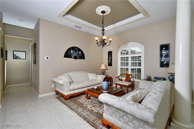 24342 Saragossa Ln, Punta Gorda, FL 33955 - living area featuring light tile patterned flooring, a notable chandelier, a raised ceiling, baseboards, and visible vents