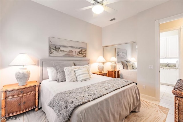 bedroom with light tile patterned flooring, visible vents, and a ceiling fan