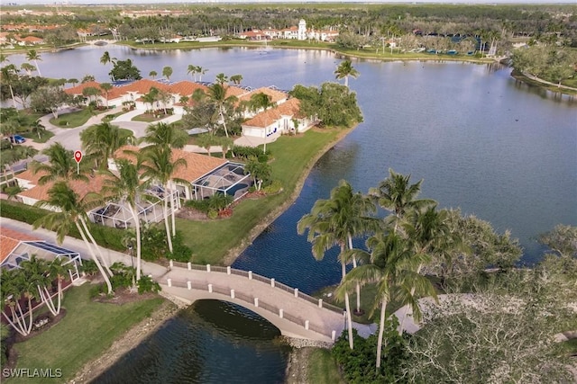 birds eye view of property with a water view