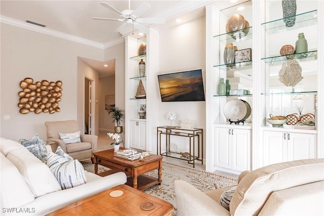 living room featuring visible vents, crown molding, ceiling fan, and built in features