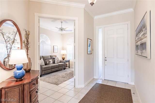 entrance foyer featuring baseboards, ornamental molding, and light tile patterned flooring