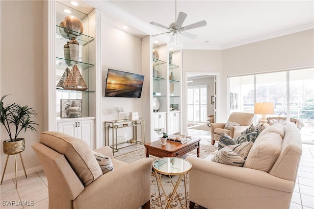 living room featuring ceiling fan, a wealth of natural light, and built in features