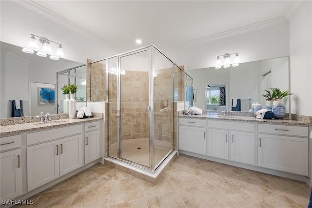 14600 Sycamore Ct Unit 2022, Punta Gorda, FL 33955 - bathroom with crown molding, two vanities, a shower stall, and tile patterned flooring