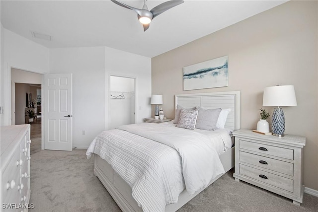 14600 Sycamore Ct Unit 2022, Punta Gorda, FL 33955 - bedroom featuring light carpet, a closet, baseboards, ceiling fan, and a walk in closet