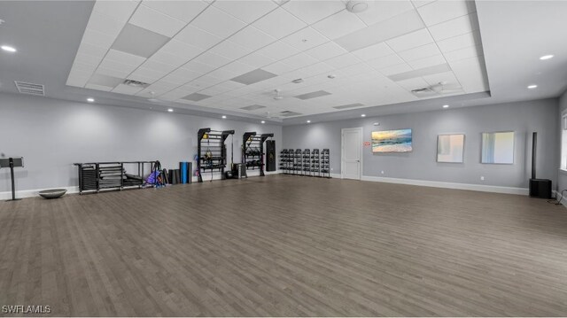 14600 Sycamore Ct Unit 2022, Punta Gorda, FL 33955 - exercise room featuring wood finished floors, baseboards, and a drop ceiling