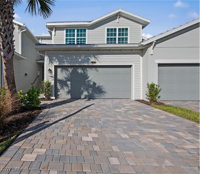 14600 Sycamore Ct Unit 2022, Punta Gorda, FL 33955 - traditional-style house featuring an attached garage and decorative driveway