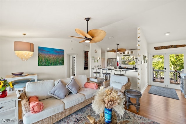 5773 Sanibel Captiva Rd, Sanibel, FL 33957 - living area featuring light wood-type flooring, a ceiling fan, french doors, and vaulted ceiling
