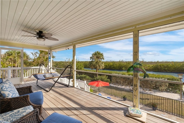 5773 Sanibel Captiva Rd, Sanibel, FL 33957 - wooden deck featuring ceiling fan and a water view