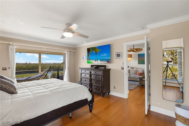 5773 Sanibel Captiva Rd, Sanibel, FL 33957 - bedroom featuring wood finished floors, ornamental molding, access to exterior, and baseboards