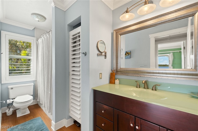 5773 Sanibel Captiva Rd, Sanibel, FL 33957 - full bathroom with vanity, a healthy amount of sunlight, toilet, ornamental molding, and wood finished floors