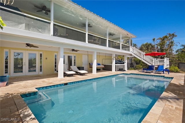 5773 Sanibel Captiva Rd, Sanibel, FL 33957 - rear view of house featuring a ceiling fan, stairway, and french doors