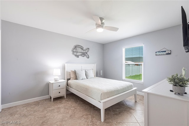 3801 SW 1st Ln, Cape Coral, FL 33991 - bedroom featuring baseboards and ceiling fan