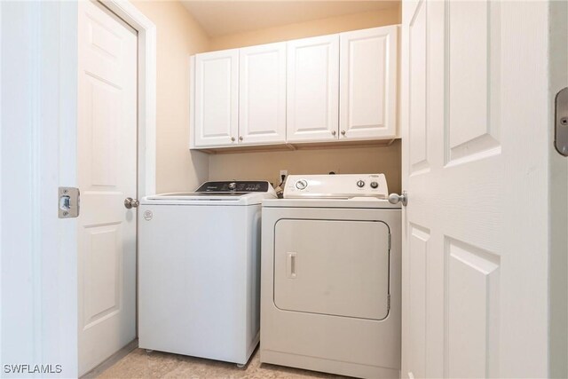 3801 SW 1st Ln, Cape Coral, FL 33991 - laundry room featuring cabinet space and washer and clothes dryer