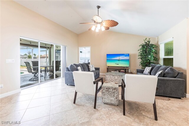 3801 SW 1st Ln, Cape Coral, FL 33991 - living area featuring light tile patterned floors, baseboards, a ceiling fan, and lofted ceiling
