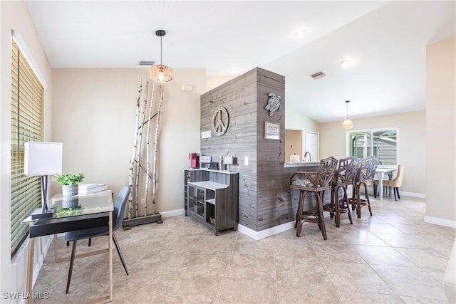 3801 SW 1st Ln, Cape Coral, FL 33991 - bar featuring visible vents, pendant lighting, baseboards, and lofted ceiling