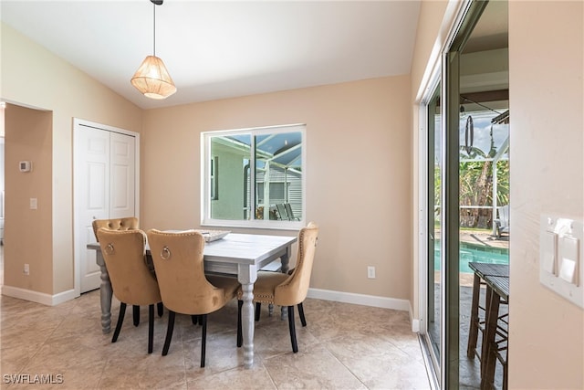 3801 SW 1st Ln, Cape Coral, FL 33991 - dining room featuring baseboards and vaulted ceiling