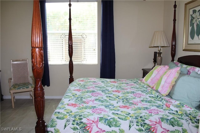 14768 Cranberry Ct, Naples, FL 34114 - bedroom featuring light tile patterned floors and baseboards
