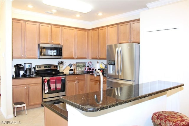 14768 Cranberry Ct, Naples, FL 34114 - kitchen with dark stone countertops, recessed lighting, crown molding, light tile patterned flooring, and appliances with stainless steel finishes