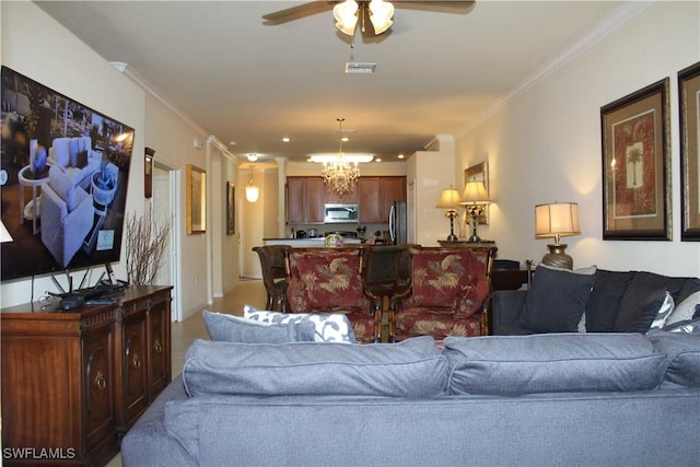 14768 Cranberry Ct, Naples, FL 34114 - living room with visible vents, ceiling fan with notable chandelier, and ornamental molding