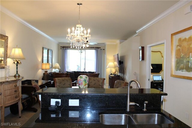 14768 Cranberry Ct, Naples, FL 34114 - kitchen featuring a chandelier, crown molding, dark countertops, decorative light fixtures, and a sink