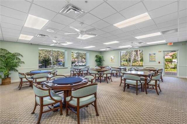 14768 Cranberry Ct, Naples, FL 34114 - carpeted dining space featuring plenty of natural light, visible vents, a paneled ceiling, and ceiling fan
