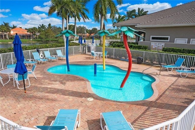 14768 Cranberry Ct, Naples, FL 34114 - pool with a patio and fence