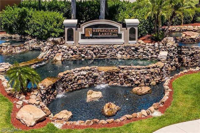 14768 Cranberry Ct, Naples, FL 34114 - community sign featuring a garden pond