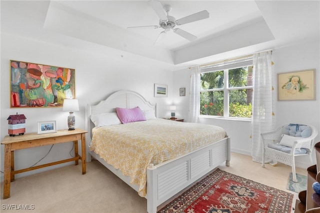 10520 Amiata Way Unit 104, Fort Myers, FL 33913 - bedroom with a tray ceiling, light colored carpet, and a ceiling fan