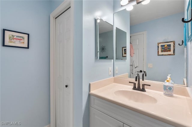 10520 Amiata Way Unit 104, Fort Myers, FL 33913 - bathroom featuring a closet and vanity
