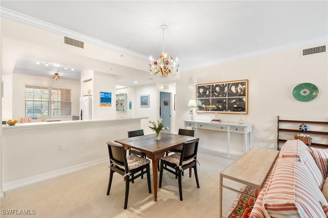 10520 Amiata Way Unit 104, Fort Myers, FL 33913 - carpeted dining area featuring a chandelier and crown molding