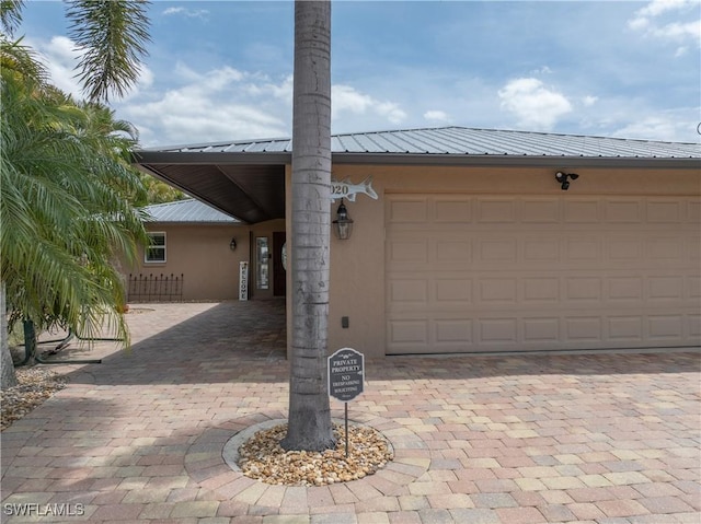 2020 Aruba Ave, Fort Myers, FL 33905 - garage featuring decorative driveway