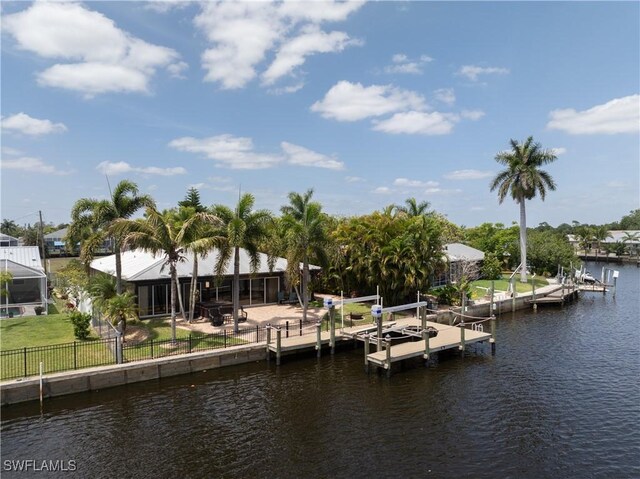 2020 Aruba Ave, Fort Myers, FL 33905 - dock featuring a water view and boat lift