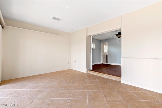 2020 Aruba Ave, Fort Myers, FL 33905 - empty room with a ceiling fan, light tile patterned floors, and baseboards