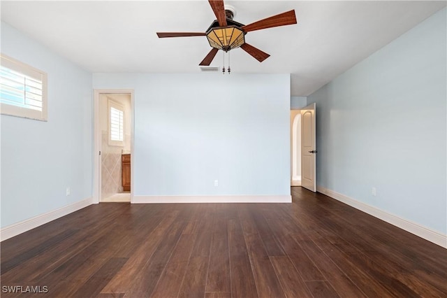 2020 Aruba Ave, Fort Myers, FL 33905 - spare room featuring dark wood-type flooring, a ceiling fan, and baseboards