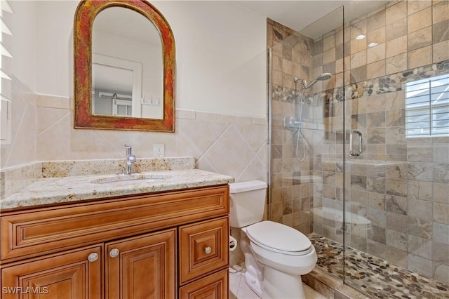 2020 Aruba Ave, Fort Myers, FL 33905 - full bathroom featuring tile walls, a shower stall, toilet, and vanity